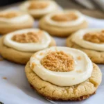 Freshly baked New York Cheesecake Cookies topped with graham cracker crumbs